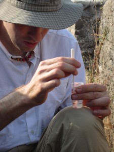 Adam Rausch preparing a pH buffer in the field